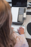 Woman using Ergo-Top 320 Circular Laptop Stand.