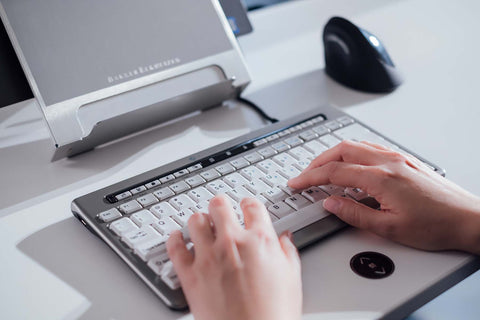 Person typing on bakker elkhuizen s-board 840 compact keyboard.
