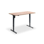 A simple, rectangular wooden desk with a black metal frame.