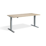 A simple, rectangular wooden desk with a minimalist design.