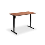 A simple, rectangular wooden desk with black metal legs.