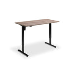 A simple, rectangular wooden desk with black metal legs.