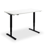 A simple, rectangular white desk with black legs.