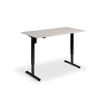 A simple, rectangular desk with a flat top and two black metal legs.