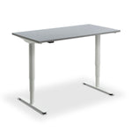 a modern, minimalist desk with a gray top and white legs.