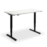 A simple, rectangular standing desk with a white top and black metal legs.