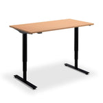 A simple, rectangular wooden standing desk with black metal legs.