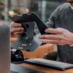 Man using Bakker Elkhuizen Ergo-Q 160 portable Laptop Stand.