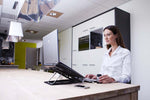 Woman working with Bakker Elkhuizen Ergo-Q 330 Laptop Stand