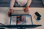 Woman using PRF Ergonomic Vertical Wireless Mouse at desk