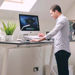 Man using bakker elkhuizen document holder at his desk.