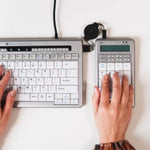 Person using bakker elkhuizen s board 840 numeric keyboard.