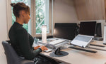 Woman typing on bakker elkhuizen s-board 840 compact keyboard at ergonomic setup.