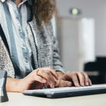 person typing on ultraboard 950 wireless compact keyboard