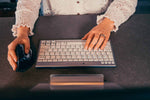 woman working with UltraBoard 950 Wireless Compact Keyboard