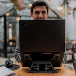 Front view of man using Aluminium universal laptop stand.