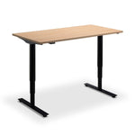 A simple, rectangular beech standing desk with a black metal frame.