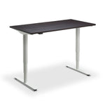a modern, minimalist desk with a dark wood top and white legs.