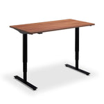 A simple, rectangular wooden desk with black metal legs.