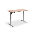 A simple, rectangular wooden desk with a metal frame, standing alone against a white background.