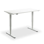 A white adjustable standing desk with two white legs.