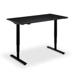 A black adjustable standing desk with a sleek, modern design.