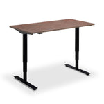 a simple, rectangular standing desk with a black metal frame.