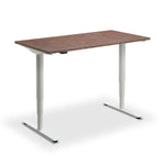 a simple, rectangular wooden desk with a brown top and white legs.