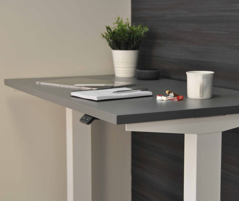 Side view of mini sit stand desk.