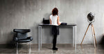 woman working at 4 legged standing desk