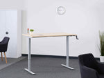 manual standing desk in an office 